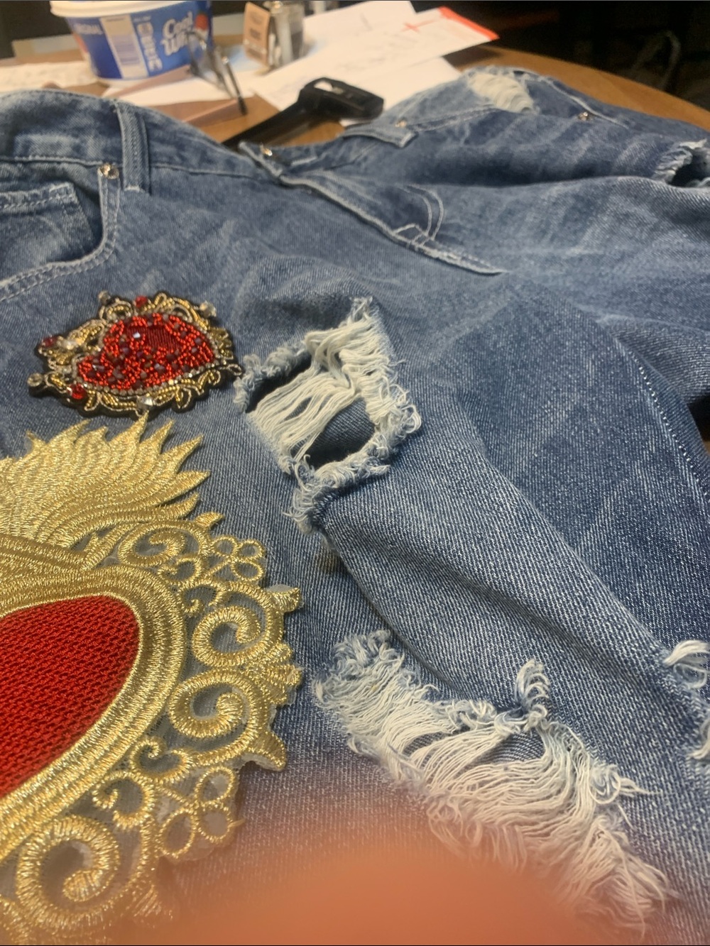 True Religion Blue Distressed Jeans with Red & Gold Heart Appliqués. Tote 4 - Picture 3 of 11